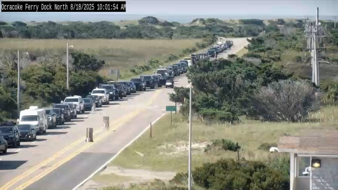 This image provided by the North Carolina Department of Transportation shows a line of vehicles waiting to evacuate Ocracoke Island ahead of life-threatening impacts from Hurricane Erin.